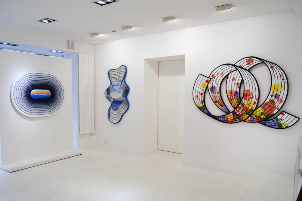 Jenna Krypell's sculptural paintings on display in a contemporary white-box gallery, showcasing her signature layered forms