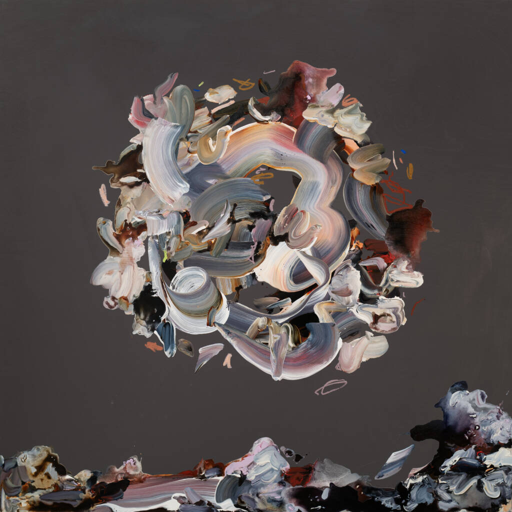 a grey sky and waves crash into the land with a circle of abstract shapes floating above it