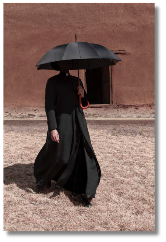 Dark-clad figure walking beneath umbrella across sunlit neutral landscape. Cinematic composition from the electric horizon art collection exploring contrast, solitude, and muted earth tones.
